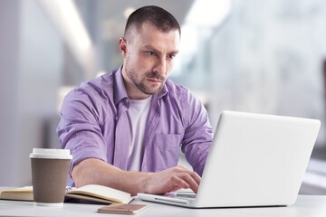 Fototapeta premium Mature business man using laptop computer having video conference call