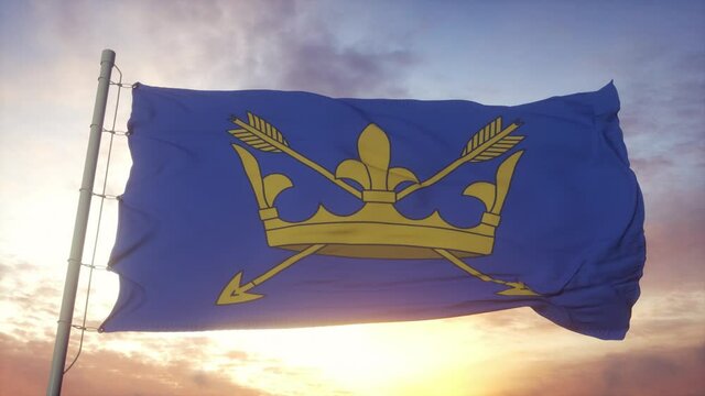 Suffolk flag, England, waving in the wind, sky and sun background