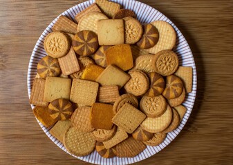 wheat biscuits also called food cracker famous as chai biscuit in india and pakistan served with tea mostly displayed in plate top view, selective focus
