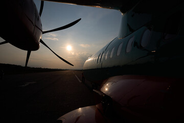 Aircraft propeller. Outside view. Sunset and plane. High quality photo