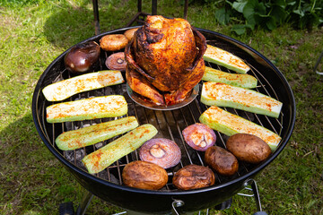 Chicken carcass baked on a kettle grill - 459549777