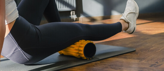 Myofascial release  massage Fitness, fit, Girl engaged in stretching  fascia by fitness  gym. Wellness, health care, lifestyle, generation sports recreation concept with roller for myofascial release