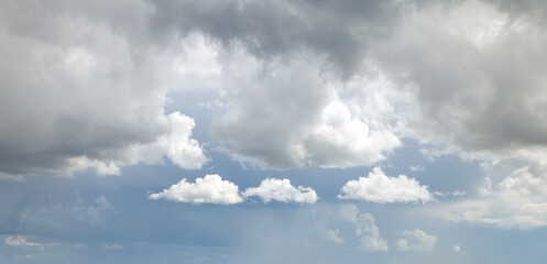 White clouds against a stormy sky