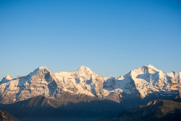 Mountains Eiger, Mönch and Jungfrau in the Berner Oberland at sunset, Switzerland