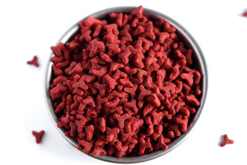 Dry red cat food in metal bowl isolated on white background