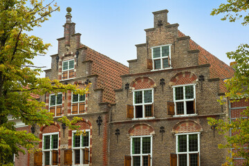 Fototapeta na wymiar Facades of the canal houses in the old picturesque town of Oudewater, Netherlands.