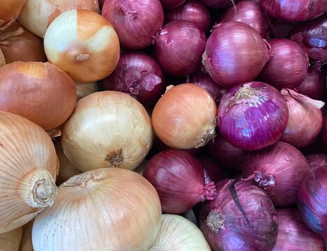 Red And Yellow Onions At The Market