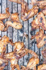 delicious fried chicken wings on the grill. High quality photo