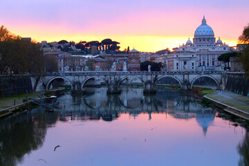 Fototapeta premium The colors of the sunset on the river with Vatican City on the back