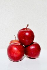 red apples on a white table