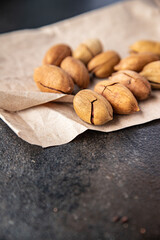 pecan fresh nut in shell snack on the table copy space food background rustic. top view vegan or vegetarian food