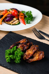 fried chicken wings on the cafe table