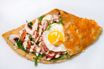 pancake with bacon and egg on a white background