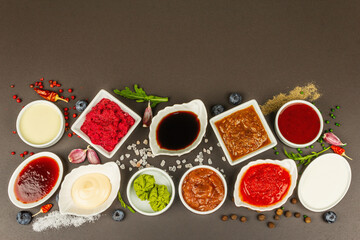 Set of different sauces - ketchup, mayonnaise, barbecue, soy, chutney, wasabi, adjika, horseradish