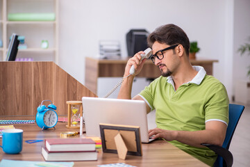 Young male designer working in the office