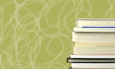 Stack of colored study books on a background in a bookstore