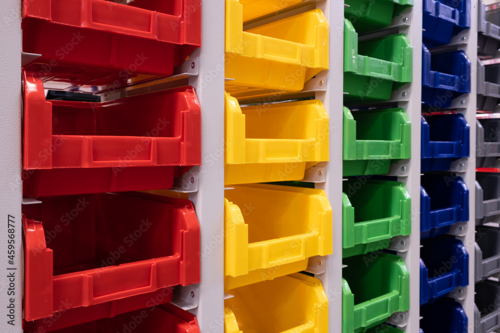 Aufkleber rows of multicolored plastic boxes for components
