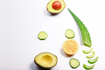 Ingredients mask of aloe on a light background. Aloe plant, avocado, cucumber, honey and lemon. Homemade natural cosmetics and treatments