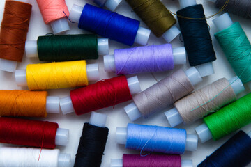 The background image. There are a lot of multi-colored threads that lie in a chaotic order.