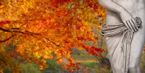 Banner with a statue of ancient sensual Renaissance Era woman in front of trees in golden Autumn...
