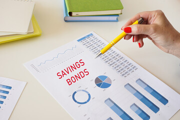 Financial concept about SAVINGS BONDS with sign on the page.