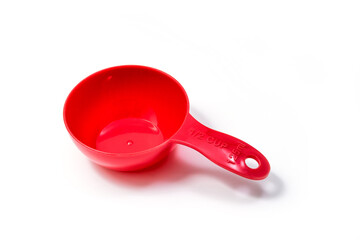 Red ingredient measuring scoop or spoon - half size. Isolated on white background with Clipping path