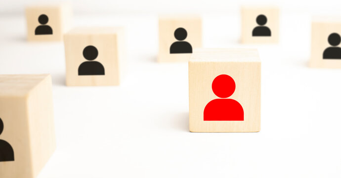 Red Wooden Cube With Person Icon Stand Out From The Crowd On Blue Background.