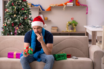 Young man celebrating Christmas at home