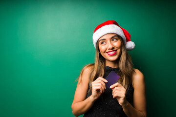 Cheerful woman planning to buy gifts