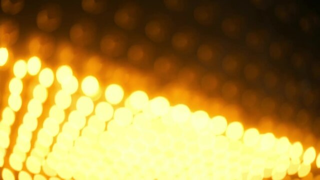 Background video with unfocused Warm orange floodlight bulb lights turn on and turn off, matrix moving light.