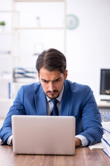 Young businessman employee working in the office