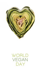 Conceptual design for the World Vegan day with heart shaped artichoke. Top view in vertical format