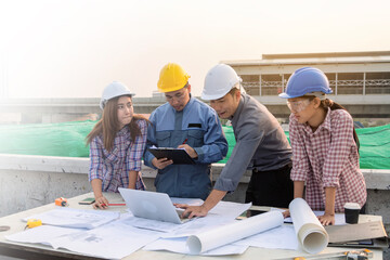 team of construction engineers are working together at the site.