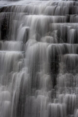 Fototapeta na wymiar Rushing Water Steps Down The Rocks Of Brandywine Falls