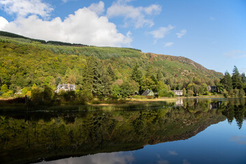 Fototapeta na wymiar Reflections on Loch Ard in Scotland, UK