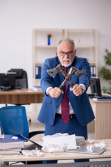 Old male employee unhappy with excessive work in the office