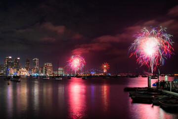 Colorful fourth of July fireworks display during the Big Bay Boom over the bay in San Diego, California  © Ashwin