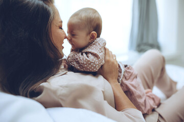 Fototapeta Woman with a baby. Beautiful mother with a baby. High quality photo obraz