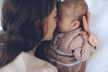 Woman with a baby. Beautiful mother with a baby. High quality photo - obrazy, fototapety, plakaty