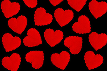 Red hearts on black background. hearts texture. hearts background