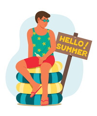 Man Sit On Pile of the Inflatable Ring and the Nearby Wood Placard with Hello Summer Words.