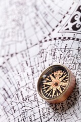 Fototapeta na wymiar old compass on vintage map 1732