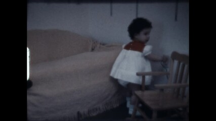 Child Plays With Receptacle. 1977 - A child plays with an electrical receptacle. 