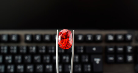 Ruby is in the gemstone tongs. It is a selected ruby for jewelry making.