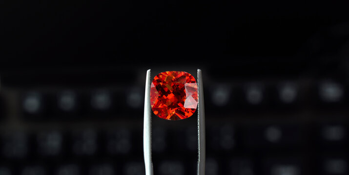 Ruby is in the gemstone tongs. It is a selected ruby for jewelry making.