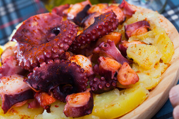 Pulpo a la gallega, spanish seafood dish of baked octopus tentacle with boiled potatoes © JackF