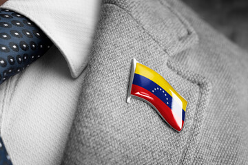 Metal badge with the flag of Venezuela on a suit lapel