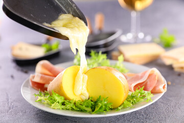 melted raclette cheese melting on potato