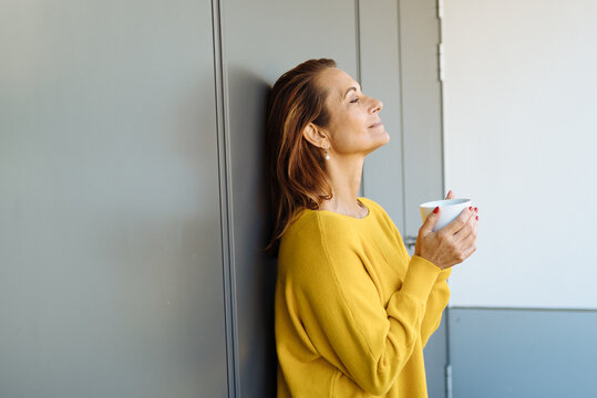 Middle-aged Woman Enjoying A Quiet Moment Of Quality Time