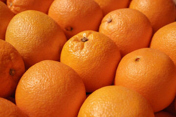 fresh oranges in the market. harvest of organic citrus. background, food texture. selective focus.